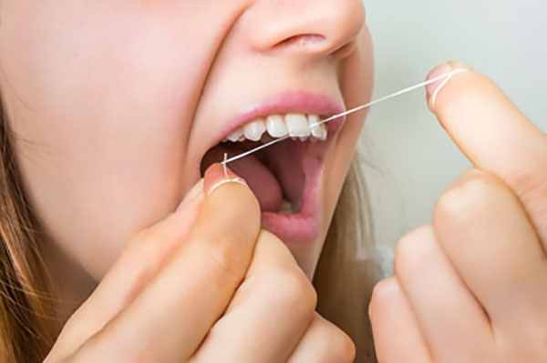 A Family Dentist Explains Why You Should Floss Every Day