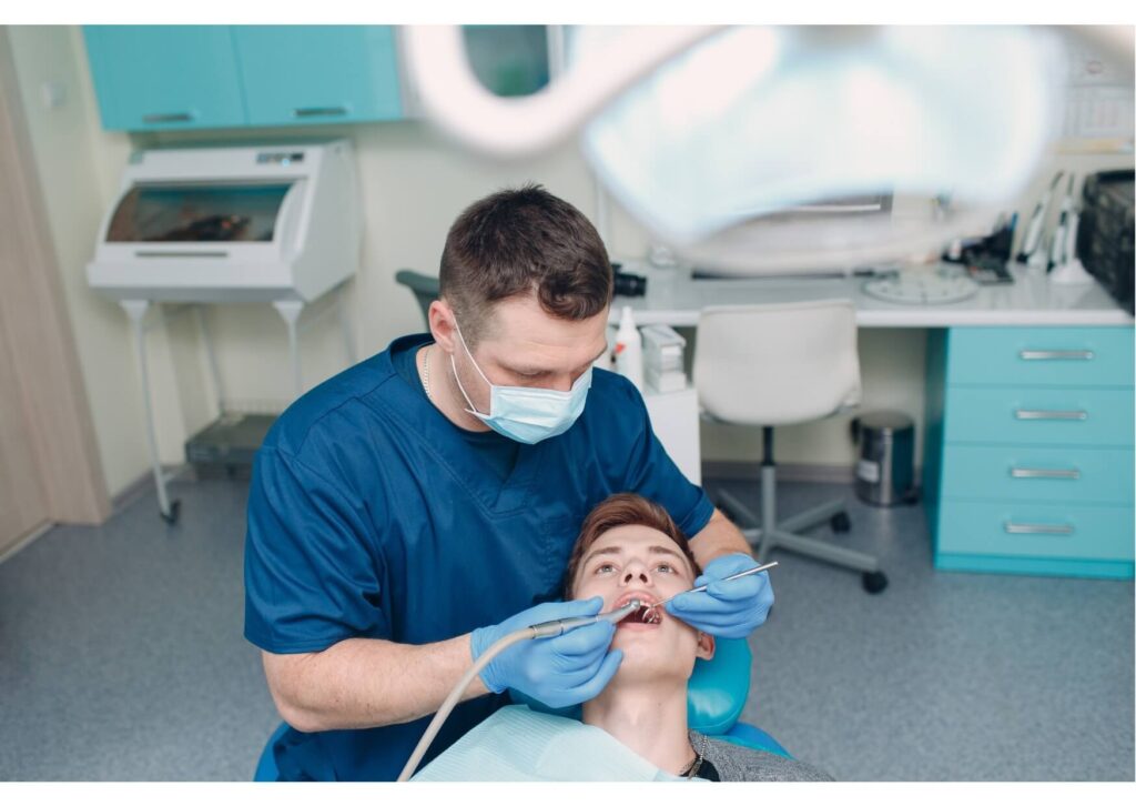 Patient receiving a dental implant evaluation and treatment planning appointment in a modern dental clinic