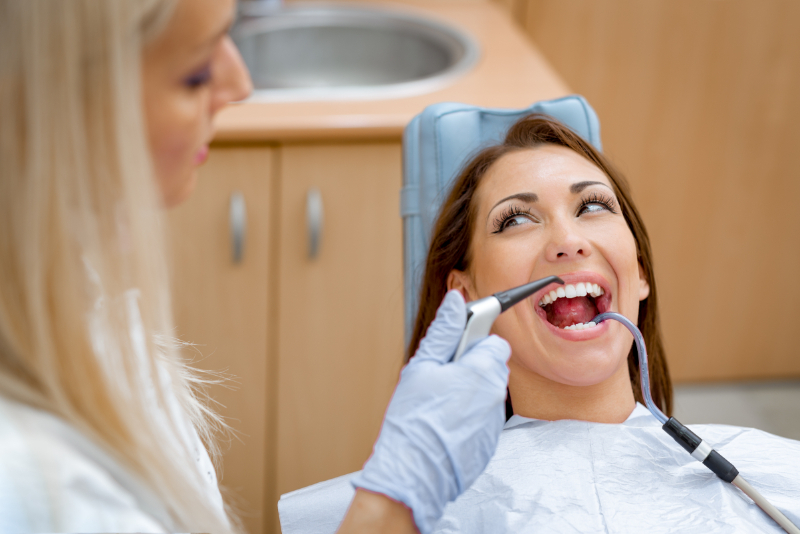 Woman receiving comprehensive dental care at NACCID