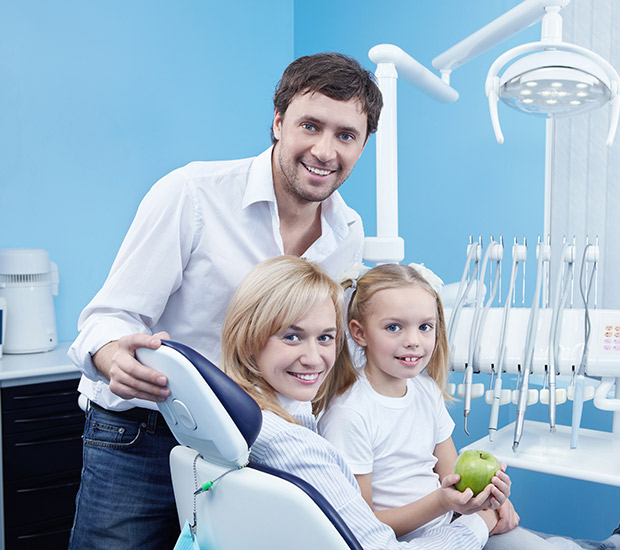 Family smiling while in the treatment room